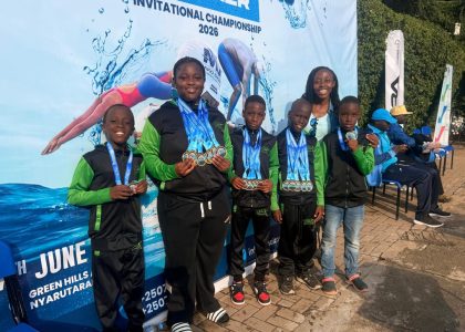 Jaguar Swim Club young swimmers posing with medals at the 5th Mako Sharks Championships in Kigali Rwanda.