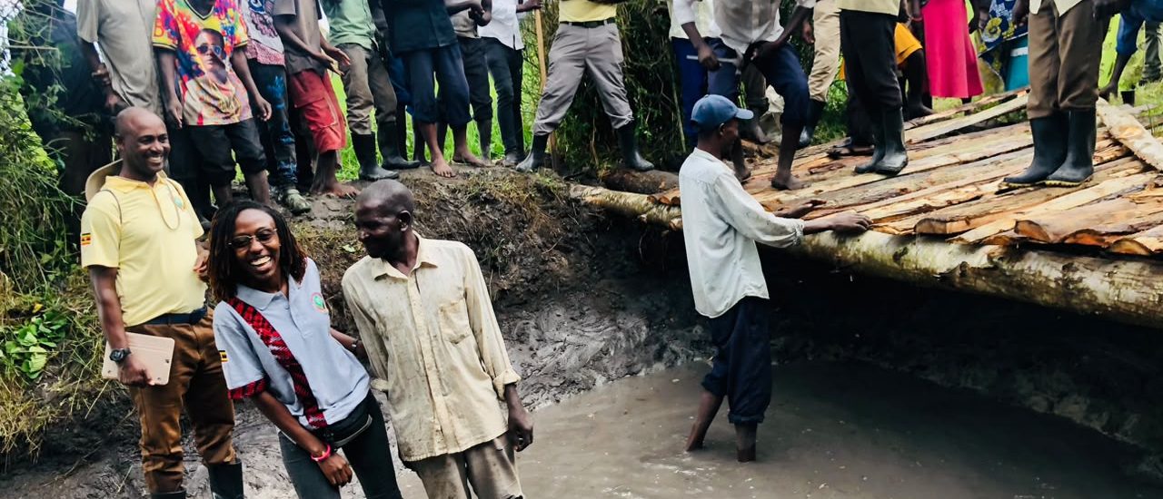 Smiling together after a job well done. This photo captures a moment of shared pride between community members and leadership, celebrating the dedication of the local men who collaborated on restoring the area's essential water source.